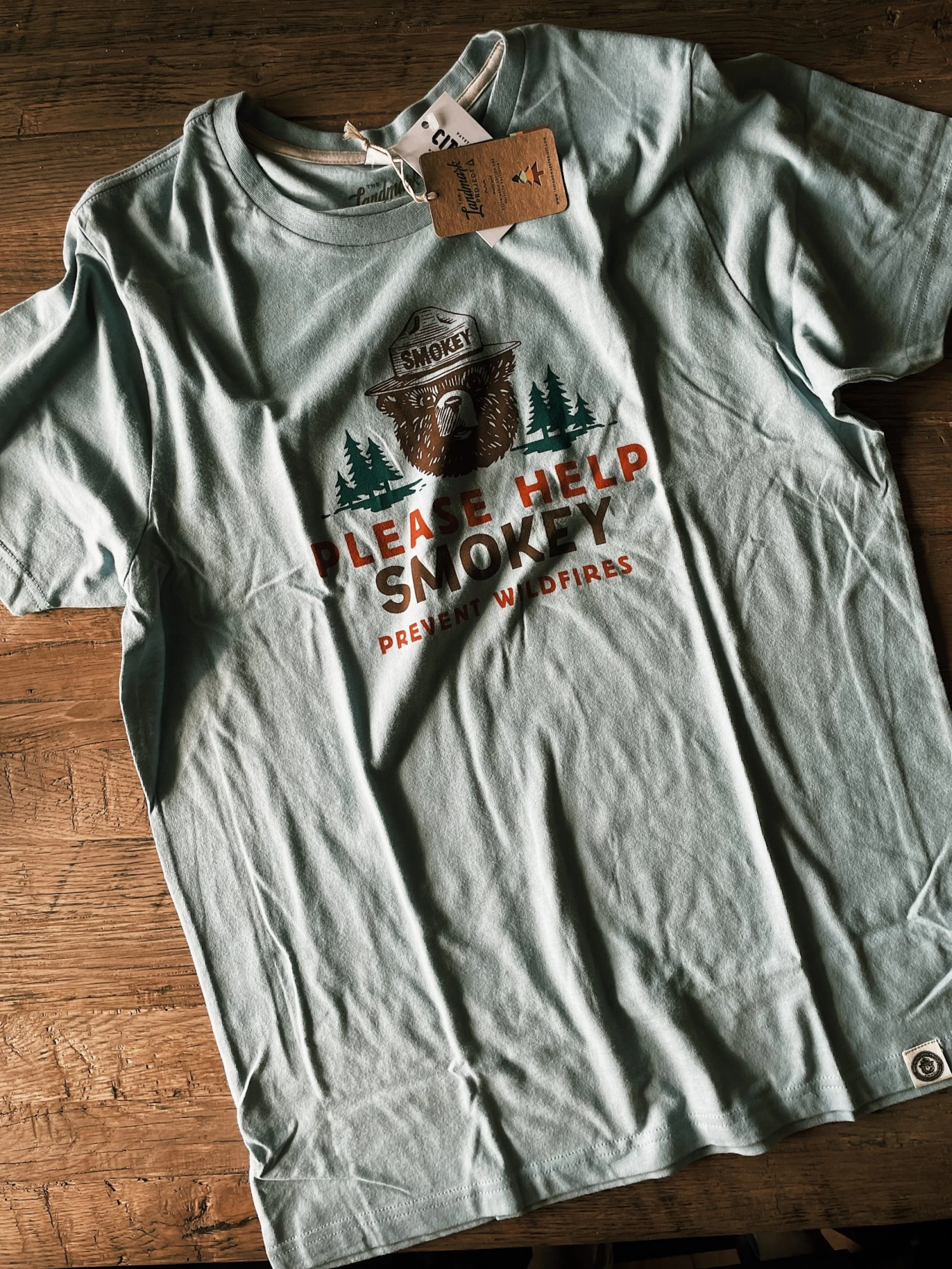 Please Help Smokey T-Shirt 1 Please Help Smokey T-Shirt